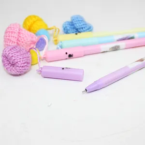 Cute cartoon gel pens with knit hat pendants, creative student stationery supplies for writing.