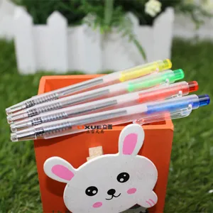 Detail view of colorful retractable mini ballpoint pens displayed in a cute rabbit pen holder.