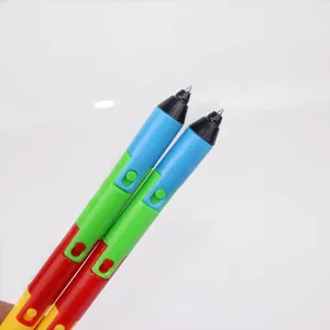 Macro detail showing the tips of two colorful segmented foldable ballpoint pens.