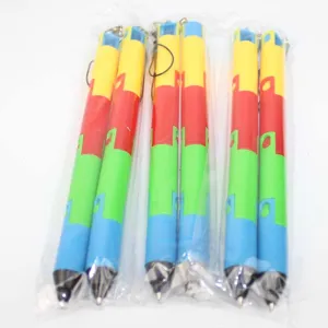 Detail view of colorful segmented foldable ballpoint pens in clear plastic packaging.