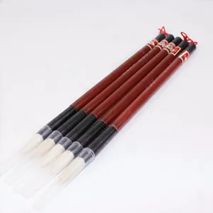 Traditional Chinese calligraphy brushes set with protective caps, ideal for beginners and students.