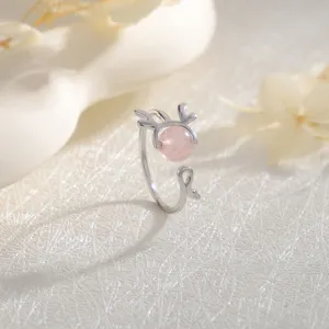 Macro view of pink strawberry quartz antler ring with elegant silver finish for women