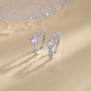 Detailed macro shot of a silver cat ring featuring pink zircon stones and cute paw motifs