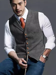 Close-up of a men's slim fit grey plaid vest with vintage single-breasted buttons