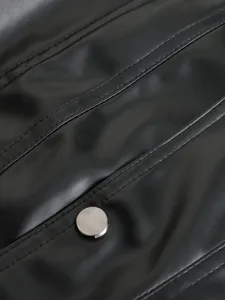 Close-up detail of men's black PU leather vest showing texture, stitching and button.