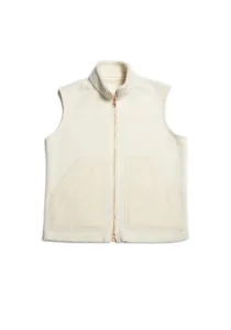 Detailed view of cream sherpa fleece vest with high collar, metal zipper, and smooth utility pockets.