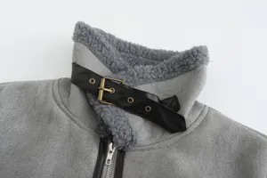 Gray shearling collar detail shot of women's short winter jacket with metal buckle strap.