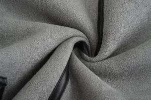 Grey suede fabric detail texture with black piping trim close up view for women apparel