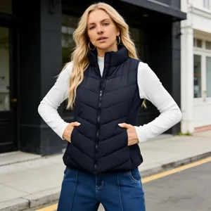 Detail view of a black stand-up collar padded vest, featuring quilted warm sleeveless winter coat.