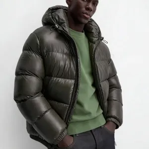 Men's glossy puffer jacket detail view, showing the stylish hooded design and cozy texture.