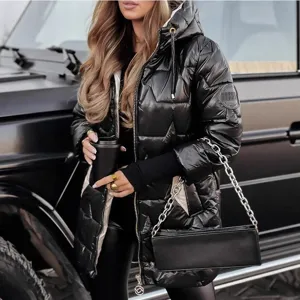 Detail shot of a shiny black hooded puffer jacket with stylish metallic hardware.