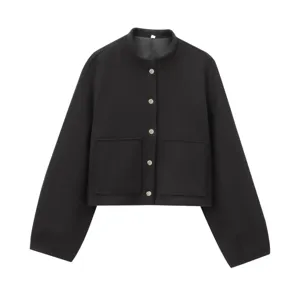 Detailed view of the black jacket featuring a stand collar, metal buttons, and patch pockets.