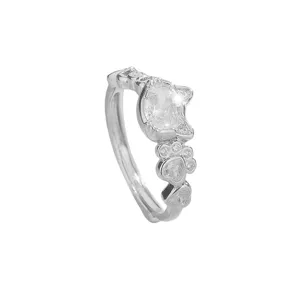 Elegant silver ring featuring a sparkling cat-shaped stone and cute paw print designs