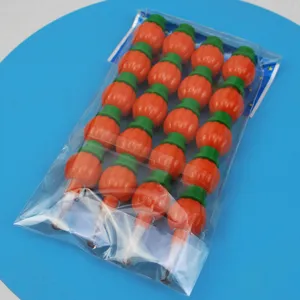 Detail view of the stackable cartoon pumpkin segment pencils in transparent packaging.
