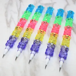 Macro detail of colorful cartoon bear stackable pencils on white marble texture surface