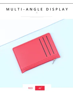 Detail view of a slim red leather card holder wallet with zipper pocket at a 45 degree angle