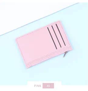 Detail view of ultra-thin pink leather card holder with three slots and side zipper