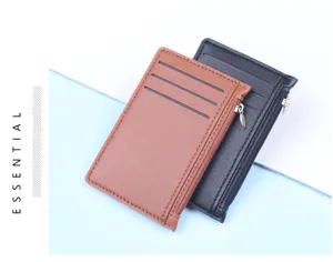 Detailed view of slim leather card holders in brown and black with zipper closure