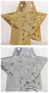 Detailaufnahme von gold- und silbernem Stern-Weihnachtsbaumspitze mit Glitzer