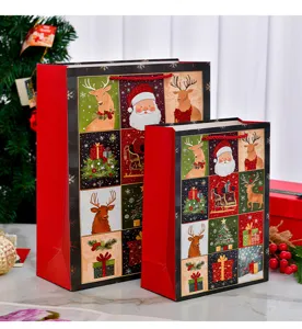 Detailed view of two festive Christmas gift bags with glittery holiday character prints.