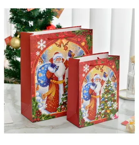 Festive Santa Claus Christmas gift bags in large and small sizes for holiday packaging.