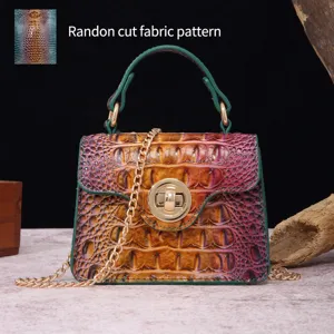 Detailed view of the random cut crocodile pattern on a vintage handbag