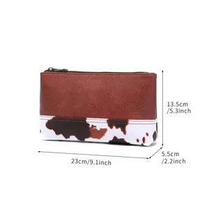 Dimensiones del neceser de cuero sintético con estampado de vaca: 23x13,5x5,5 cm
