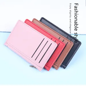 Close-up of slim leather card holders in pink red brown and black with zipper