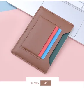 Slim brown leather passport holder and card case shown from a 45-degree angle view.