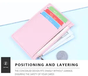 Close-up detail of a pink slim card holder showing multiple slots and secure zipper pocket