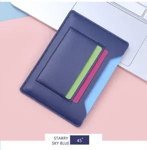 Detail view of a slim starry sky blue leather passport holder with multiple card slots