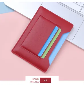 Macro view of an ultra-thin red leather card holder with multiple functional slots