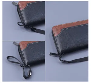 Close-up details of men's color-block leather long wallet with wrist strap and zipper.