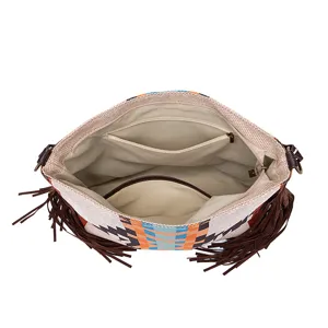 Internal view of the vintage woven cotton linen tote bag showing interior pockets and tassels.