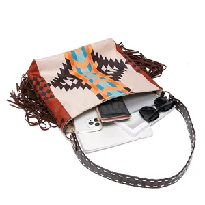 Detail view of large vintage fringe tote showing capacity for tablet, wallet, and sunglasses