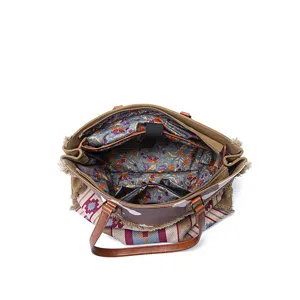 Detailed interior view of a bohemian canvas tote bag featuring a vibrant floral pattern lining