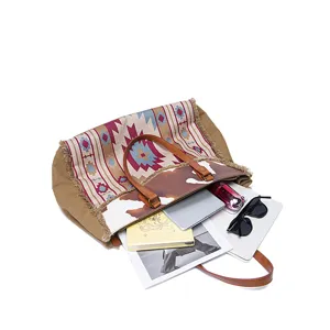 Spacious Bohemian canvas tote bag showing internal capacity with laptop and essentials