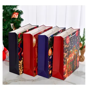 Assorted large Christmas paper gift bags with festive patterns and sturdy rope handles