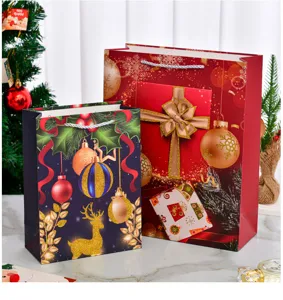 Festive Christmas gift paper bags with reindeer and glittery ornament designs for gifts