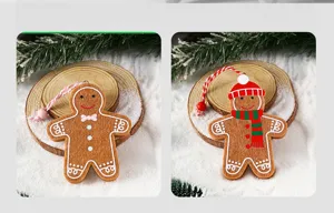 Felt gingerbread man ornaments with Christmas hat and scarf for tree decoration.