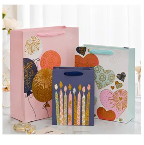Elegant birthday gift bag set with gold glitter balloons hearts and candles