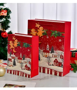 Festive red Christmas gift bags with gingerbread and snowy village glitter design