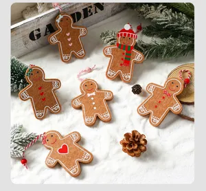 Detail shot of six handcrafted felt gingerbread man ornaments for Christmas tree decor.
