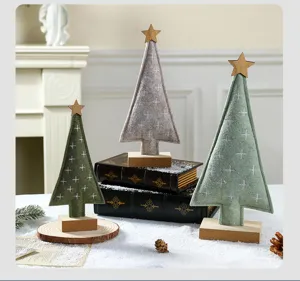 Three felt Christmas trees with wooden bases and star toppers for holiday tabletop decor.