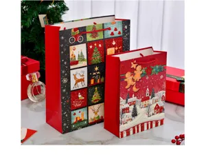 Detailed view of festive Christmas gift bags featuring glittery holiday village patterns