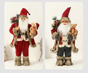 Detailed side-by-side view of two festive Santa Claus figurines holding teddy bear ornaments