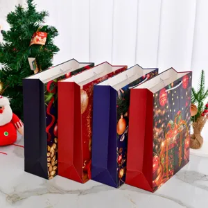 Set of four large Christmas paper gift bags with festive holiday prints