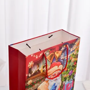 Grande sacchetto regalo di Natale con motivo Babbo Natale e manici in corda rossi