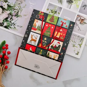 Festive Christmas gift paper bag with cartoon patterns and red rope handles on marble