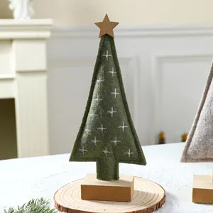 Handmade green felt Christmas tree tabletop ornament with wooden star on wooden base